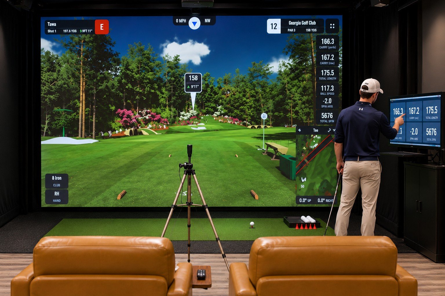 Golfer reviewing launch monitor numbers on a simulator touchscreen at APEX Golf Lab